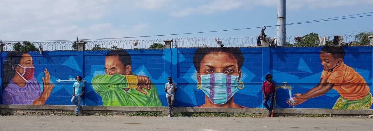 Mural paintings with COVID-19 messaging by the Haitian artist Hamson Elysee at a border post in Haiti. Ouanaminthe. June 2020. ©IOM Haiti