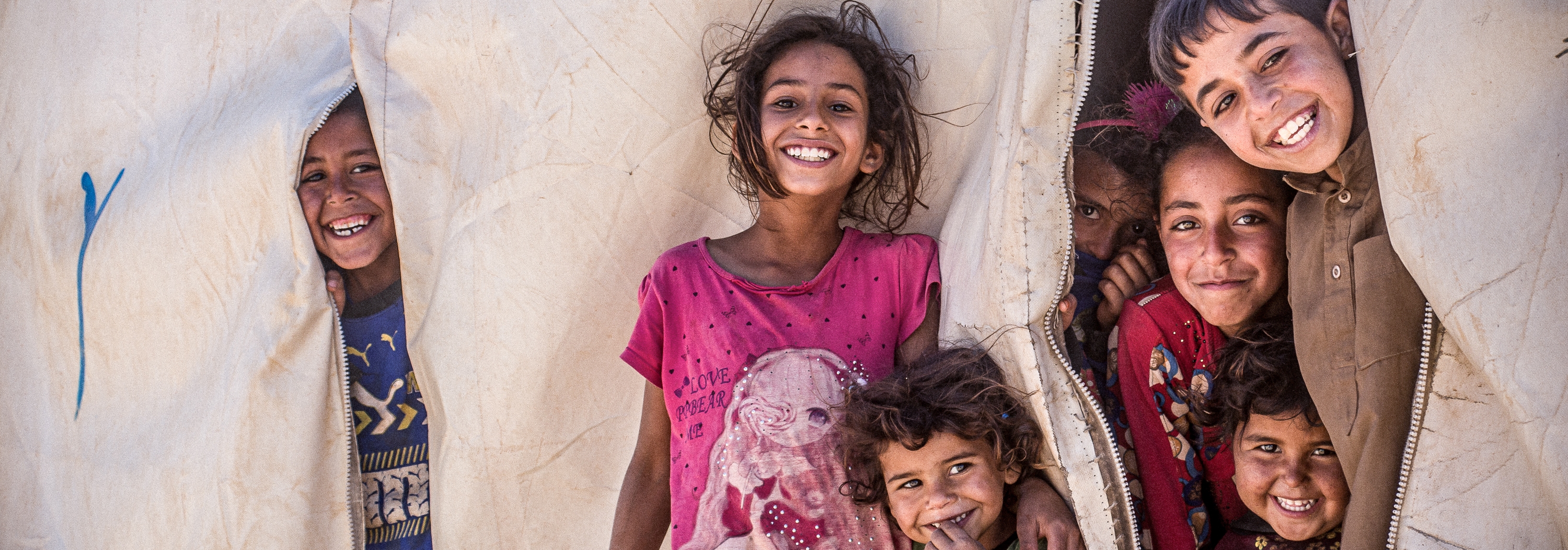 Children shelter from the harsh heat in one of northwest Syria's IDP camps. © IOM 2022