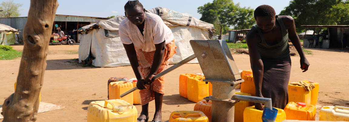 Women collect water from an IOM-constructed borehole. IOM 2022 / Nabie Loyce