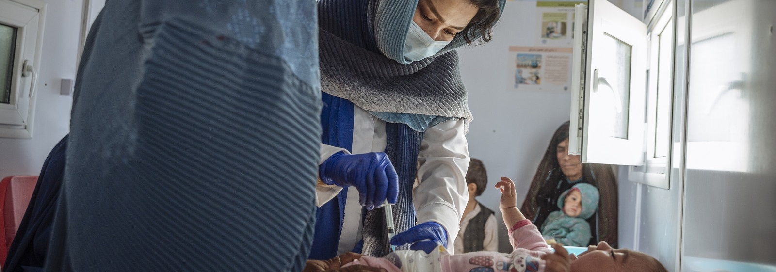 IOM Afghanistan’s Mobile Health Clinic in Shahrak Sabz IDP settlement (Herat) offers health services such as vaccinations, reproductive, maternal and child health, and health education. 2021 © IOM/Muse Mohammed