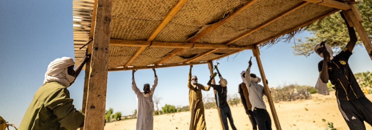 Men in Lake Chad Province are working on a shelter construction 