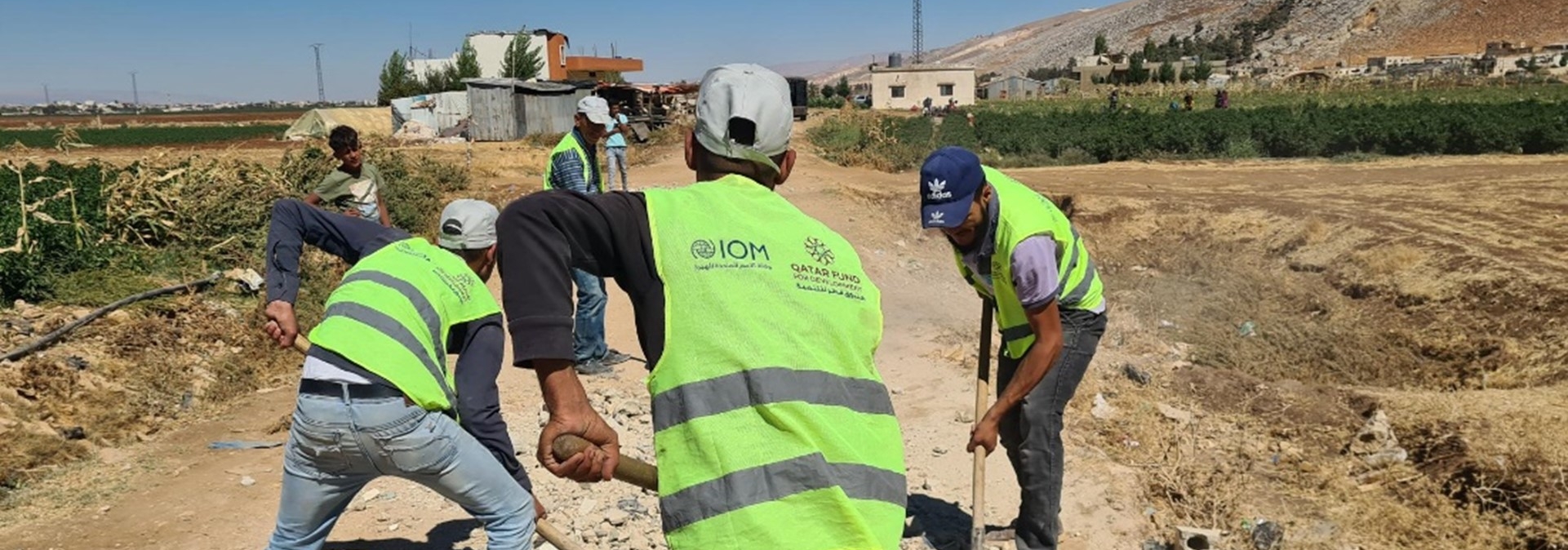 Cash for Work beneficiaries rehabilitating a road in Faour, Bekaa. @ IOM Lebanon 2022. 