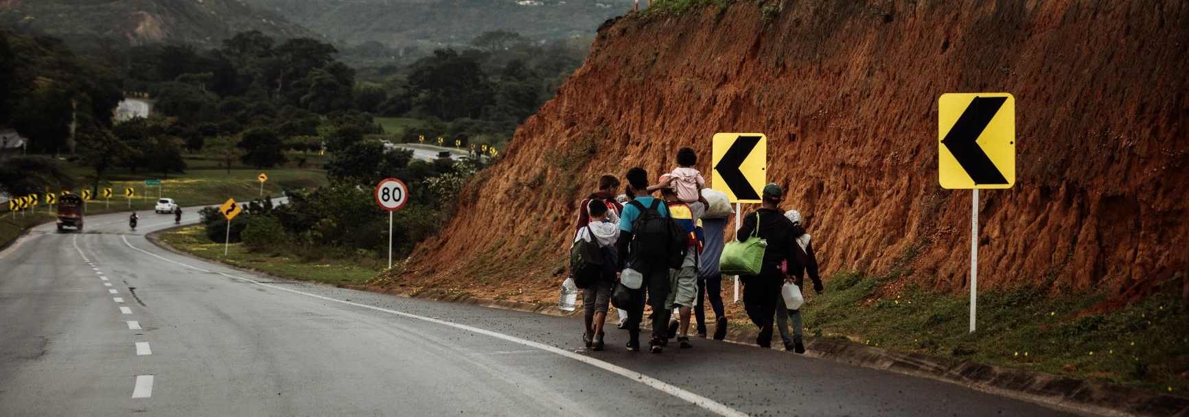 Venezuelans walk along the side of the road from the Colombian border town of Cucuta toward Pamplona, one of the first major cities along the migration route to the capital, Bogota