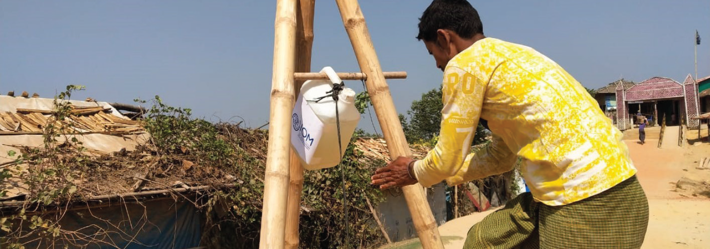 Image of a man washing his hands in an improved handwashing stations in Cox’s Bazar, Bangladesh.